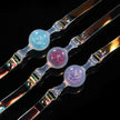 Foam_Handmade_Soft_Silicone_BDSM_Ball_Gag: Handmade BDSM ball gags (sex gags) crafted from soft silicone, showcasing iridescent straps and three shimmering color variants (blue, red, purple), blending artisanal design for kink play.