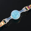Foam_Handmade_Soft_Silicone_BDSM_Ball_Gag: Handmade BDSM ball gag (sex gag) featuring iridescent rainbow - sheen straps and a blue foam - embedded silicone ball, blending artisanal design for kink play.