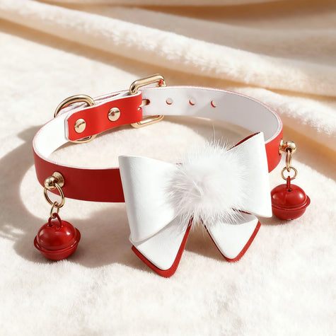 Red and white leather choker with a large bow, featuring a white fluffy pom-pom and dangling red bells with gold hardware