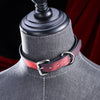 Red heat-reactive leather choker with a polished silver roller buckle and D-ring