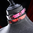 Red and pink heat-reactive leather choker with a polished silver roller buckle and D-ring