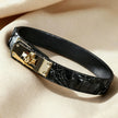 High-gloss black crocodile embossed leather choker with a polished gold-tone turn-lock metal buckle