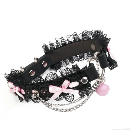 QIYE_Leather_Lilith_Collar_Choker_Heat_Reactive: A stylish choker featuring black lace, pink bows, metallic chains and rings, and a pink bell, in its color before heat - reactive transformation. 