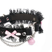 QIYE_Leather_Lilith_Collar_Choker_Heat_Reactive: Side view of the choker, featuring black lace, pink bows, metallic chains, a pink bell, and a heart - shaped metal ring. 