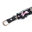 QIYE_Leather_Lilith_Collar_Choker_Heat_Reactive: Front view of the choker strap, showcasing black leather with metallic hardware, black lace trim, and a pink bow. 