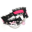 QIYE_Leather_Lilith_Collar_Choker_Heat_Reactive: A chic choker featuring black lace, pink bows, metallic components and a pink bell, showcasing its color post heat - reactive change. 