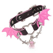 QIYE_Leather_Sweetheart_Devil_Collar_Choker: A fashionable choker featuring a black and pink gradient leather strap, metallic hardware, pink bat - wing accents with spikes, a silver chain, and a pink crystal charm. 