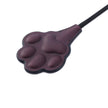 「Dog Paw」Handmade Color - changing Leather Paddle: Handmade BDSM dog paddle. Made of heat - reactive, color - changing leather. Features cute dog - paw impact surface, blending artisanal kink - play style with touch - responsive color shift, shown in paddle head close - up.
