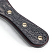 QIYE_Leathers_Heat_Reactive_Paddles_Bark_Eyes_Blackish_Red: Handmade BDSM leather carving spanking paddle. The handle showcases intricate, customizable leather - carved patterns, with a color - changing design potential, highlighting artisanal craftsmanship for kink play.