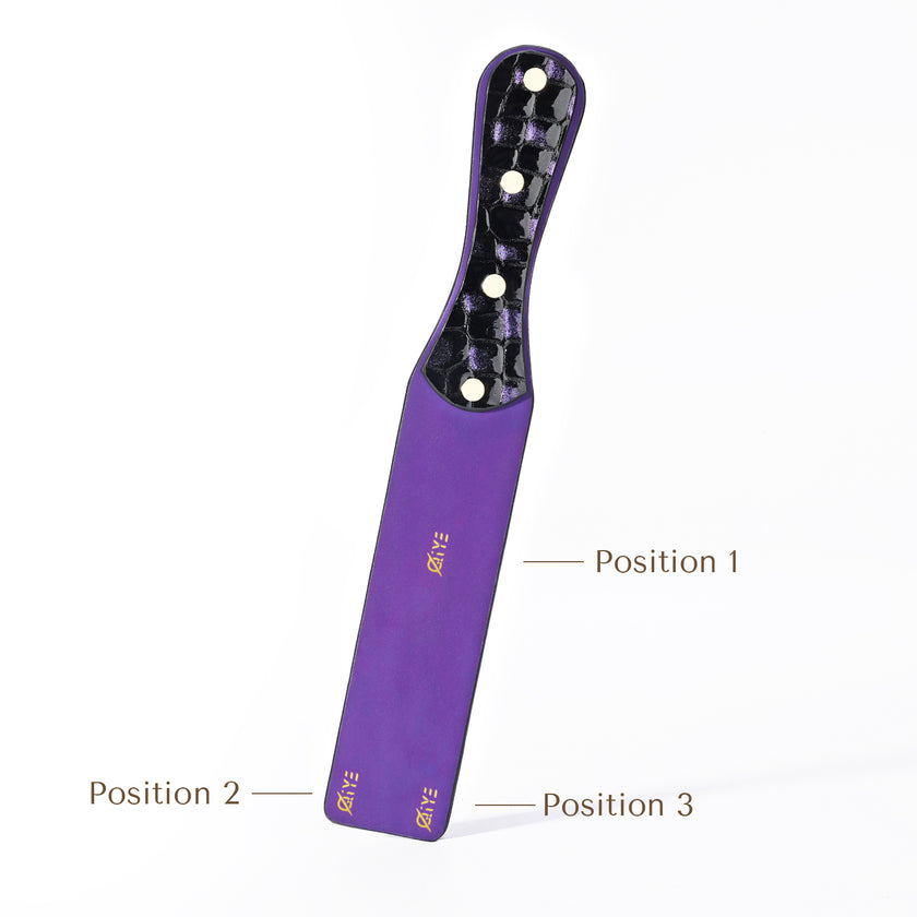 Qiye_Bark_Eyes_Violet_Paddle_original_embossing_custom: Handmade BDSM leather spanking paddle with color - changing trait. Highlights 3 customizable stamping positions for leather carving patterns, enabling personalized artisanal design for kink play.
